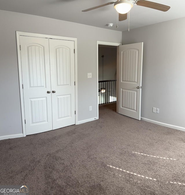 457 Panhandle Pl, Hampton, GA 30228 - unfurnished bedroom featuring carpet, baseboards, a closet, and ceiling fan