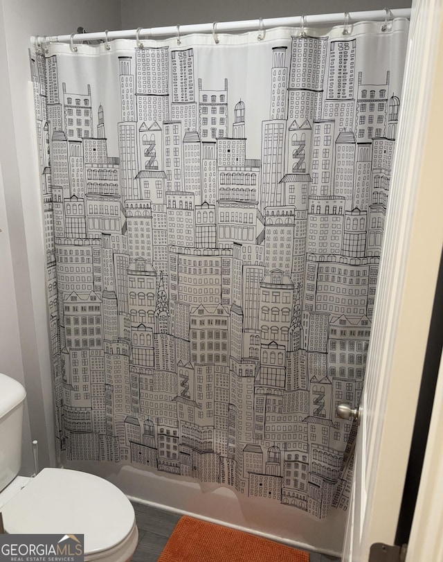 457 Panhandle Pl, Hampton, GA 30228 - full bathroom with toilet, shower / bathtub combination with curtain, and a view of city