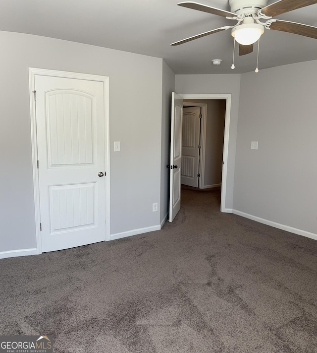 457 Panhandle Pl, Hampton, GA 30228 - unfurnished bedroom with carpet flooring, baseboards, and a ceiling fan