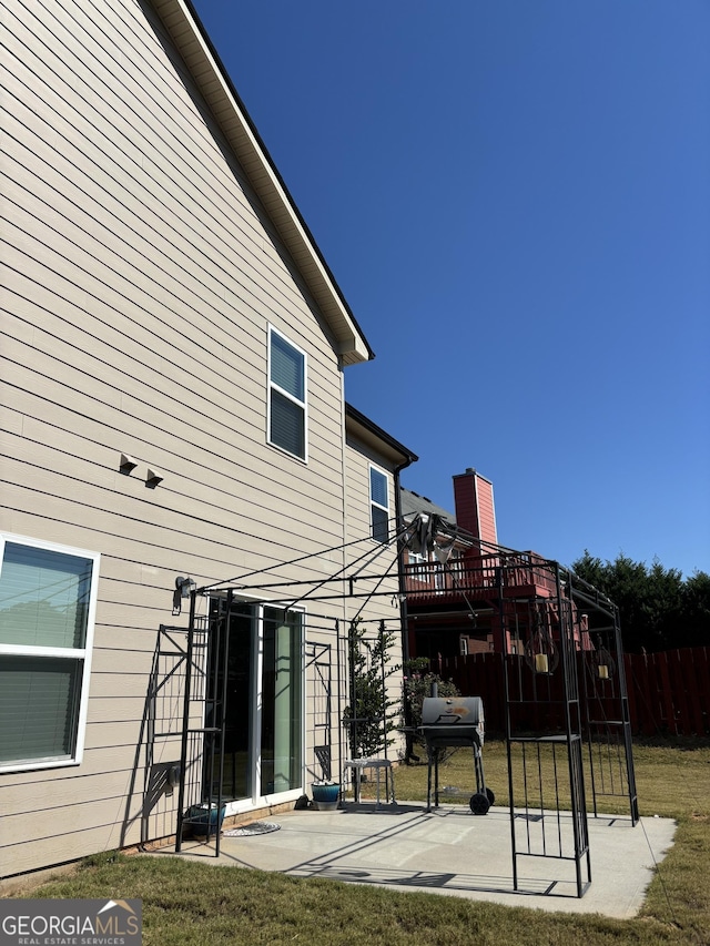 457 Panhandle Pl, Hampton, GA 30228 - back of house featuring a patio