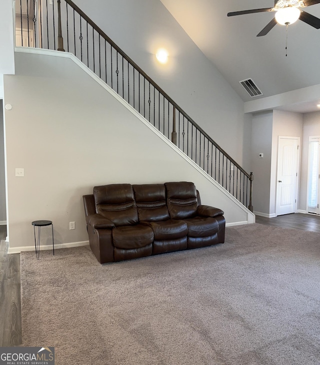 457 Panhandle Pl, Hampton, GA 30228 - living room featuring high vaulted ceiling, carpet floors, stairway, ceiling fan, and baseboards