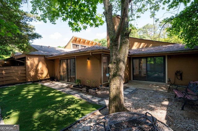 845 Lake Hollow Blvd SW, Marietta, GA 30064 - back of property with a patio and a yard
