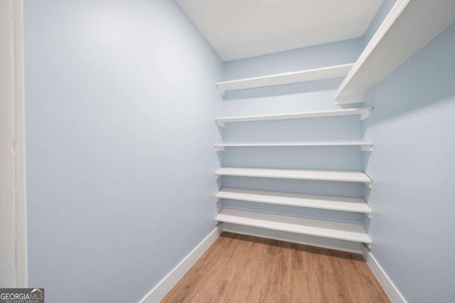 845 Lake Hollow Blvd SW, Marietta, GA 30064 - walk in closet featuring wood finished floors