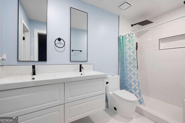 845 Lake Hollow Blvd SW, Marietta, GA 30064 - bathroom featuring toilet, a tile shower, double vanity, and tile patterned flooring
