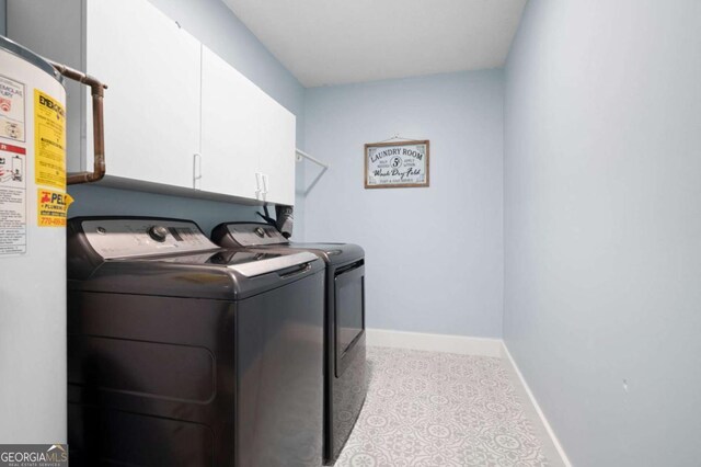 845 Lake Hollow Blvd SW, Marietta, GA 30064 - washroom featuring independent washer and dryer, water heater, baseboards, and cabinet space