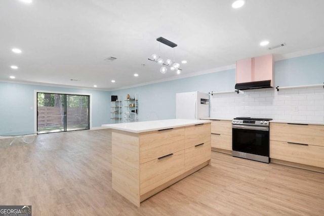 845 Lake Hollow Blvd SW, Marietta, GA 30064 - kitchen featuring modern cabinets, light brown cabinets, stainless steel gas range oven, freestanding refrigerator, and crown molding