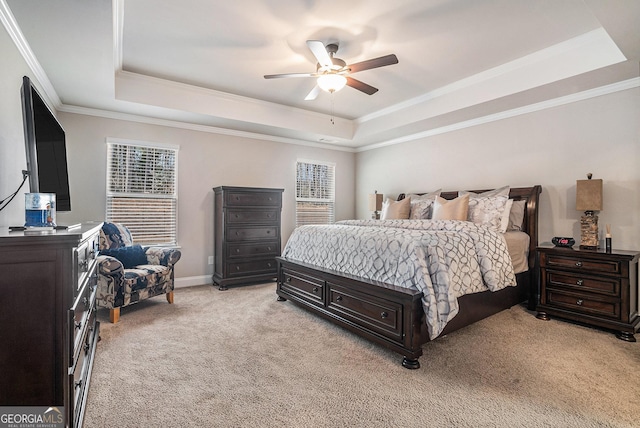 3415 Linstead Ct, Loganville, GA 30052 - bedroom with a raised ceiling, light carpet, crown molding, ceiling fan, and baseboards