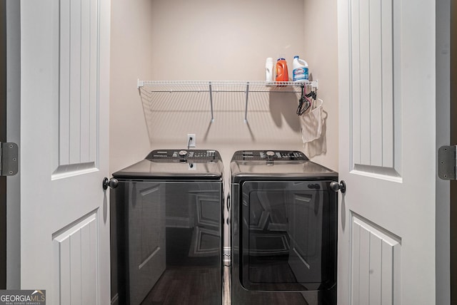 3415 Linstead Ct, Loganville, GA 30052 - laundry room with washing machine and clothes dryer and dark wood-style flooring