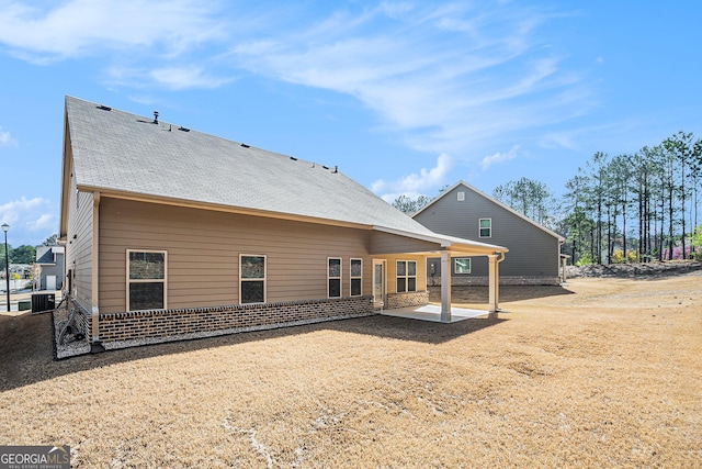 3415 Linstead Ct, Loganville, GA 30052 - rear view of house featuring central air condition unit, a patio, and brick siding