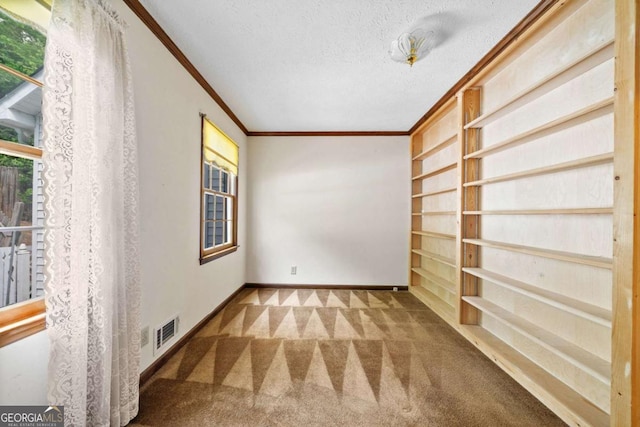 357 Breeze Hill Ln, Canton, GA 30114 - unfurnished room with ornamental molding, carpet flooring, a textured ceiling, and built in shelves