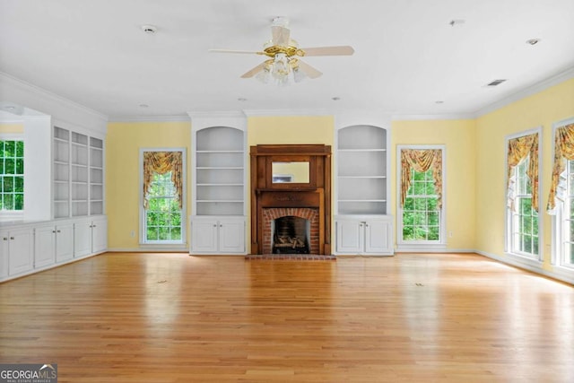 357 Breeze Hill Ln, Canton, GA 30114 - unfurnished living room featuring light wood-style flooring, built in shelves, a ceiling fan, and ornamental molding