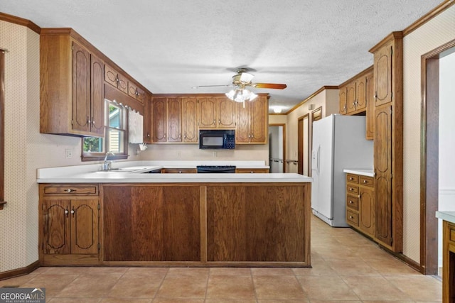357 Breeze Hill Ln, Canton, GA 30114 - kitchen with black microwave, white fridge with ice dispenser, a peninsula, light countertops, and wallpapered walls