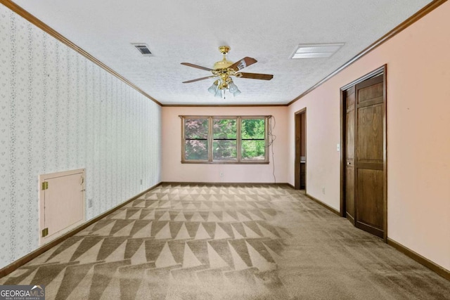 357 Breeze Hill Ln, Canton, GA 30114 - carpeted empty room featuring crown molding, a ceiling fan, and a textured ceiling