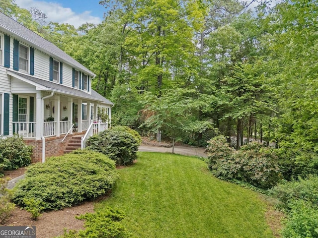 357 Breeze Hill Ln, Canton, GA 30114 - view of grassy yard featuring a porch and stairs