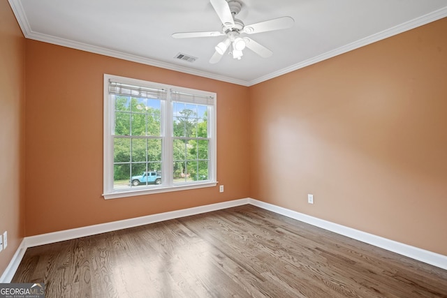 empty room with wood finished floors, baseboards, ornamental molding, and ceiling fan