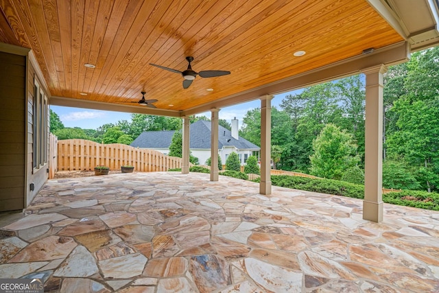 view of patio featuring fence and a ceiling fan