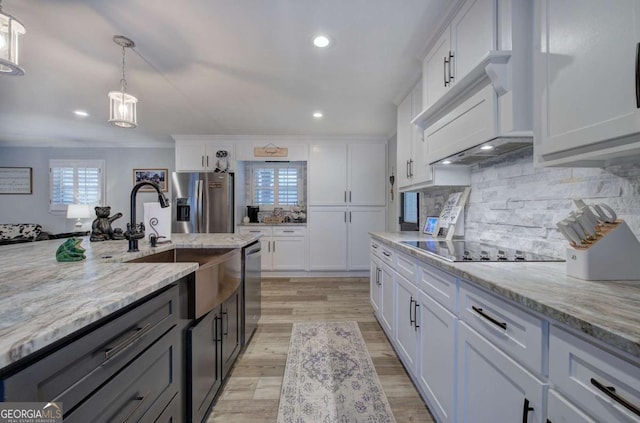 118 Arrowhead Dr, Cartersville, GA 30120 - kitchen featuring stainless steel appliances, white cabinetry, decorative backsplash, light wood finished floors, and recessed lighting
