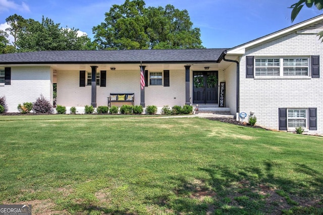118 Arrowhead Dr, Cartersville, GA 30120 - tri-level home with a front lawn and brick siding