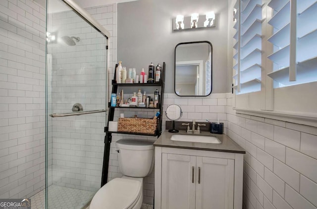 118 Arrowhead Dr, Cartersville, GA 30120 - bathroom featuring tile walls, a stall shower, toilet, and vanity
