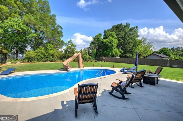 118 Arrowhead Dr, Cartersville, GA 30120 - view of pool featuring a water slide, a patio area, an outdoor fire pit, and view of wooded area