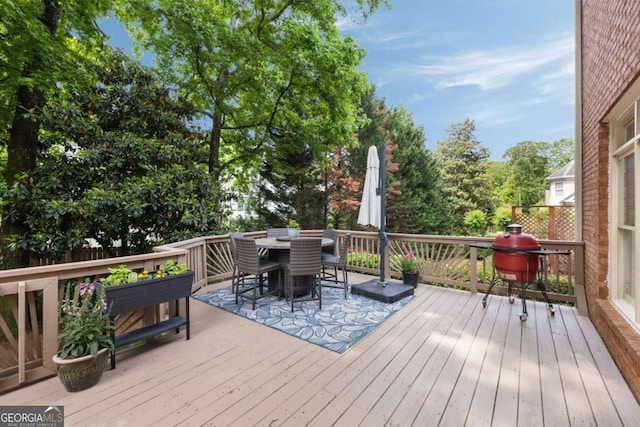 wooden deck with outdoor dining space