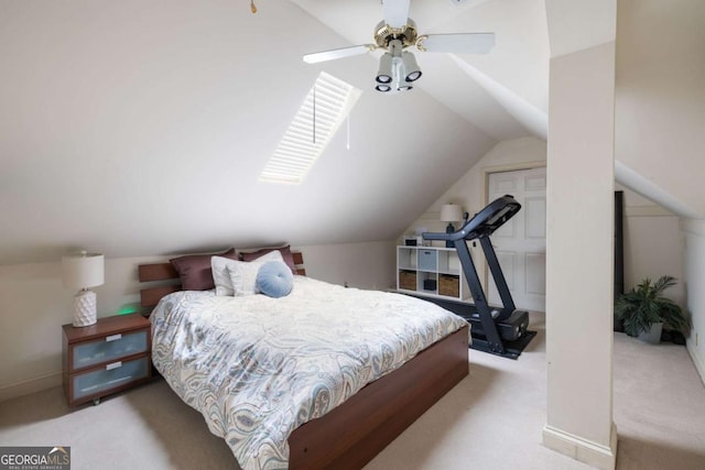 carpeted bedroom featuring vaulted ceiling and a ceiling fan
