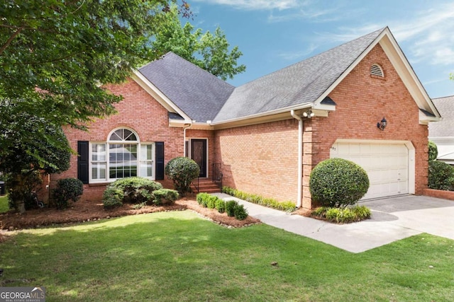 traditional-style home featuring roof with shingles, a front yard, brick siding, concrete driveway, and an attached garage