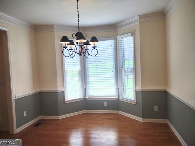 308 Bell Isle, Mcdonough, GA 30252 - unfurnished dining area featuring a chandelier, wood finished floors, baseboards, and ornamental molding