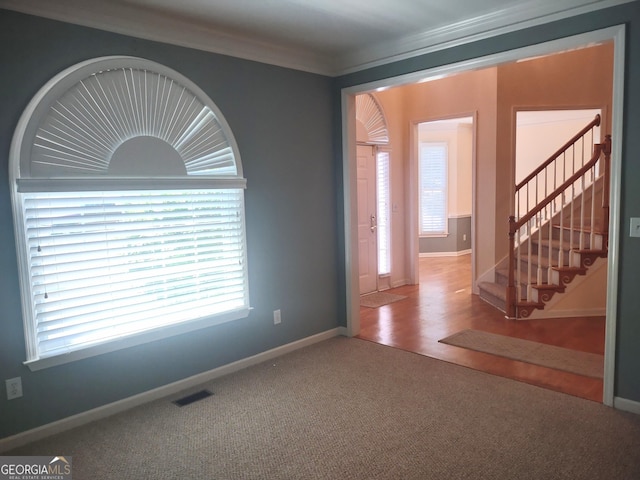 308 Bell Isle, Mcdonough, GA 30252 - carpeted spare room with stairs, baseboards, and ornamental molding