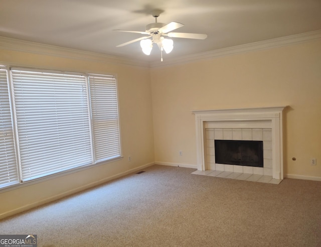 308 Bell Isle, Mcdonough, GA 30252 - unfurnished living room with ceiling fan, carpet floors, crown molding, baseboards, and a tile fireplace