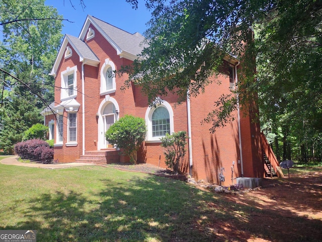 308 Bell Isle, Mcdonough, GA 30252 - view of front facade featuring brick siding, a front yard, and stairs