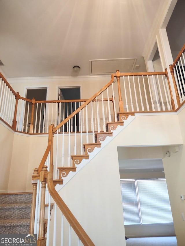 308 Bell Isle, Mcdonough, GA 30252 - staircase featuring a towering ceiling and ornamental molding