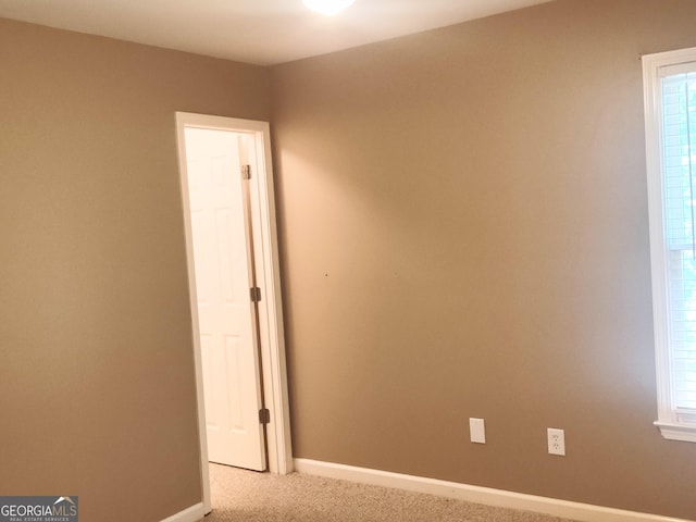 308 Bell Isle, Mcdonough, GA 30252 - spare room with carpet floors, baseboards, and healthy amount of natural light