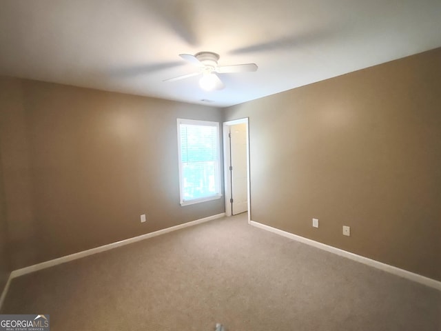 308 Bell Isle, Mcdonough, GA 30252 - empty room featuring baseboards, ceiling fan, and light carpet