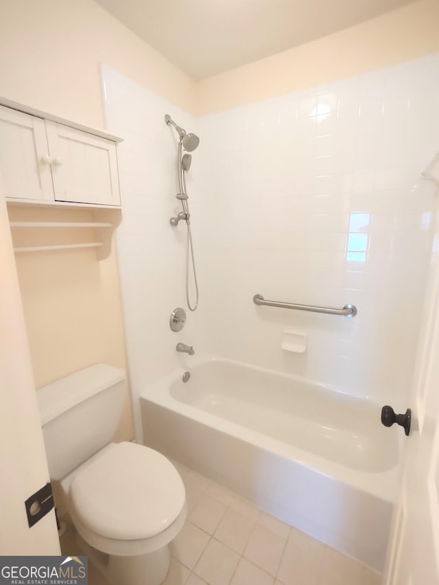 308 Bell Isle, Mcdonough, GA 30252 - bathroom featuring toilet, washtub / shower combination, and tile patterned floors