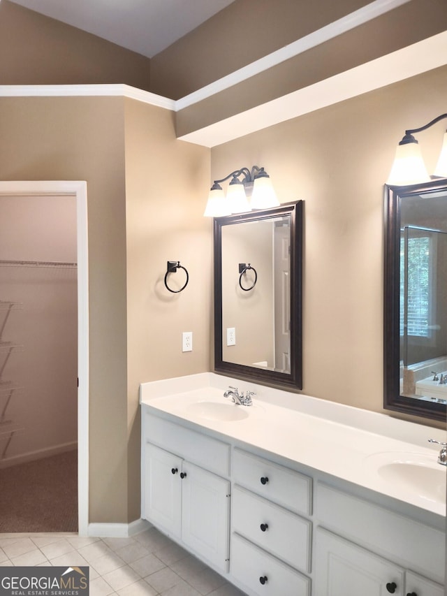 308 Bell Isle, Mcdonough, GA 30252 - full bathroom featuring double vanity, tile patterned floors, a spacious closet, and baseboards