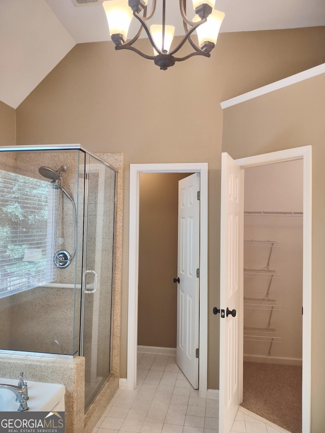 308 Bell Isle, Mcdonough, GA 30252 - full bath featuring a shower stall, a chandelier, tile patterned floors, a walk in closet, and high vaulted ceiling