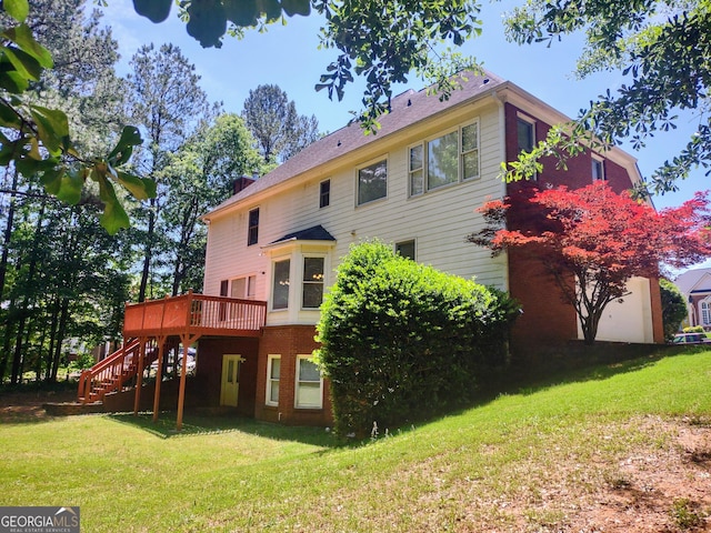 308 Bell Isle, Mcdonough, GA 30252 - back of house featuring stairway, a deck, and a lawn