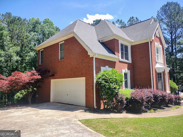 308 Bell Isle, Mcdonough, GA 30252 - view of property exterior with a garage, a shingled roof, brick siding, and concrete driveway