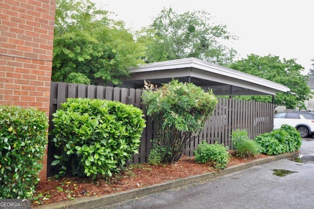 view of property exterior featuring fence