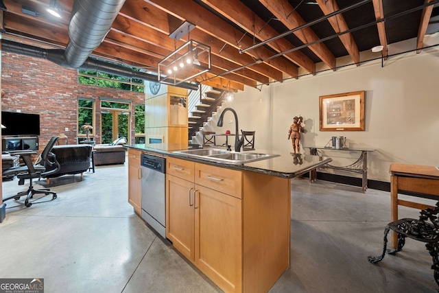 319 Atlanta St SE Unit 315, Marietta, GA 30060 - kitchen with a sink, stainless steel dishwasher, finished concrete flooring, light brown cabinets, and brick wall