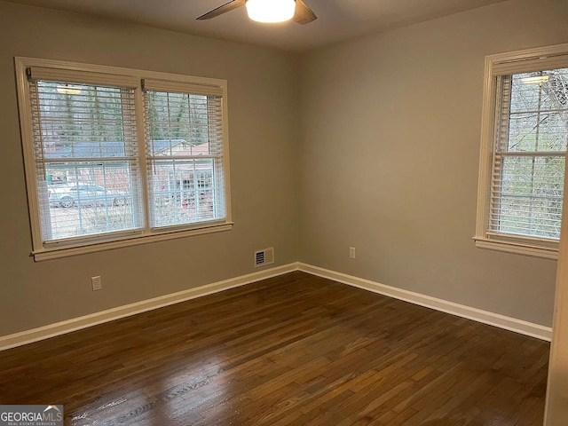 1858 Sahara Dr SE, Atlanta, GA 30316 - spare room with dark wood-type flooring, baseboards, and a ceiling fan
