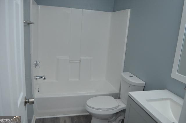 32 Haynie St Unit 0, Newnan, GA 30263 - full bathroom featuring toilet, vanity, shower / tub combination, and wood finished floors