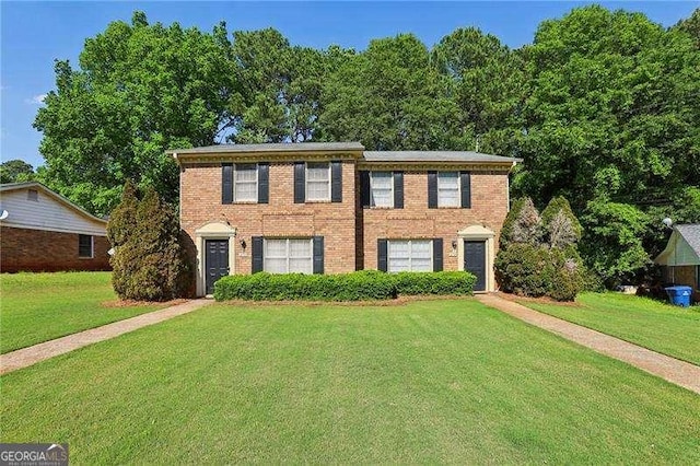 373 Dixie Ct, Lawrenceville, GA 30046 - colonial home with a front lawn and brick siding