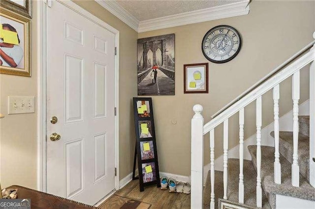 373 Dixie Ct, Lawrenceville, GA 30046 - foyer with ornamental molding, wood finished floors, stairway, and baseboards