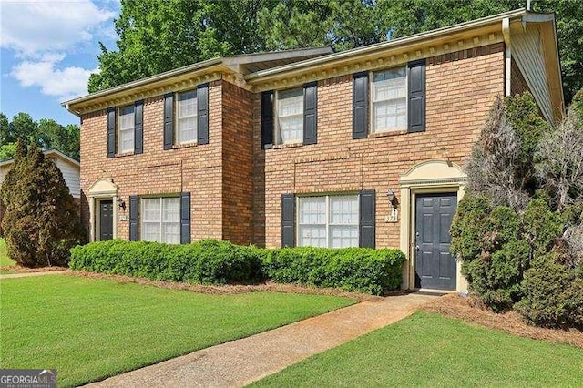 373 Dixie Ct, Lawrenceville, GA 30046 - view of front of property with a front yard and brick siding