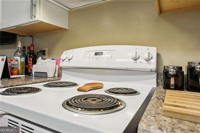 373 Dixie Ct, Lawrenceville, GA 30046 - kitchen view of white electric range and light countertops