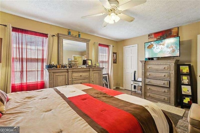373 Dixie Ct, Lawrenceville, GA 30046 - bedroom featuring a textured ceiling and ceiling fan