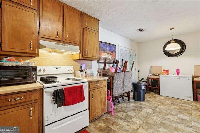373 Dixie Ct, Lawrenceville, GA 30046 - kitchen featuring electric stove, under cabinet range hood, brown cabinets, light countertops, and a textured ceiling