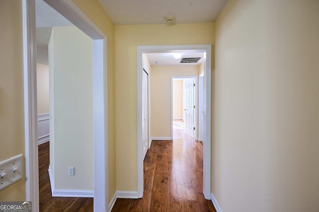3350 Cooper Woods Dr, Loganville, GA 30052 - hallway with dark wood-type flooring and baseboards